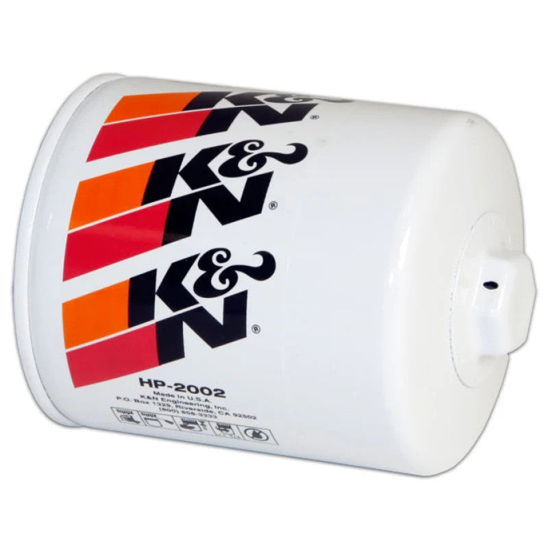 White K&N HP-2002 performance oil filter with a welded 1-inch hex nut for easy wrench removal.