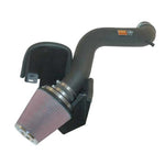 K&N 57-1538 FIPK performance intake kit with black HDPE tube, heat shield, and red oiled cotton conical filter.