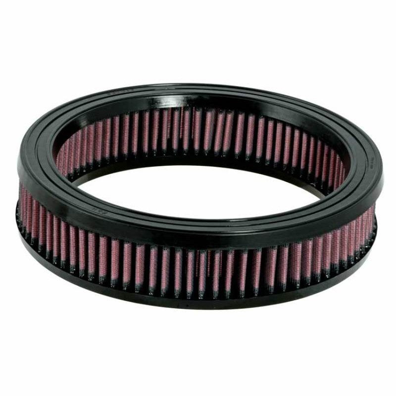 Round K&N high-flow replacement air filter with red pleated oiled cotton media and black rubber seals.