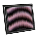 K&N 33-5034 high-flow replacement air filter featuring a red pleated oiled cotton media and black frame.