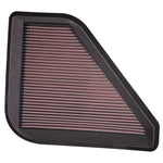 K&N 33-2394 high-flow oiled cotton drop-in air filter with red pleated media and black rubber frame.