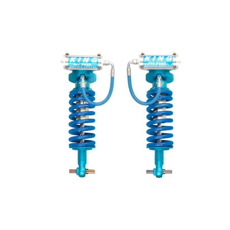 Pair of King Shocks blue and silver 2.5 diameter front coilovers with remote reservoirs and mounting hardware.