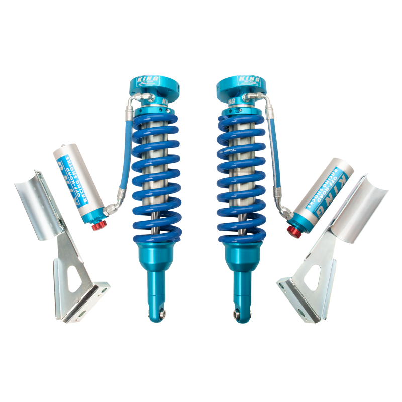 Pair of King Shocks 2.5 remote reservoir front coilovers with blue springs and external adjusters for Toyota Tacoma.