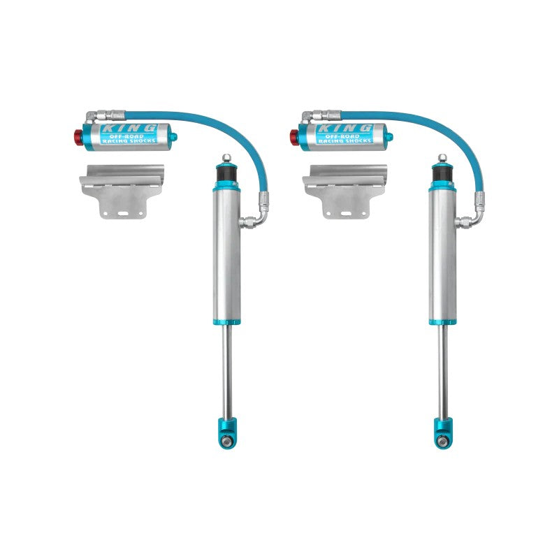 Pair of King 2.5 inch diameter blue rear remote reservoir shocks with compression adjusters for Toyota Tacoma.