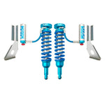 Pair of King 2.5 front coilovers with remote reservoirs, blue springs, and compression adjusters.