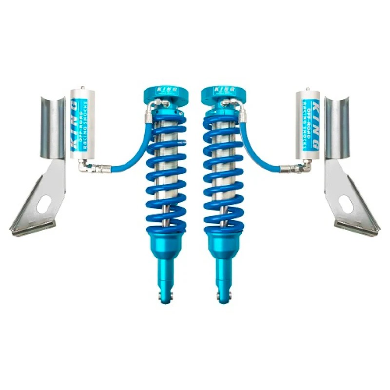 King Shocks front 2.5-inch diameter coilover shocks with remote reservoirs and silver springs for Toyota trucks