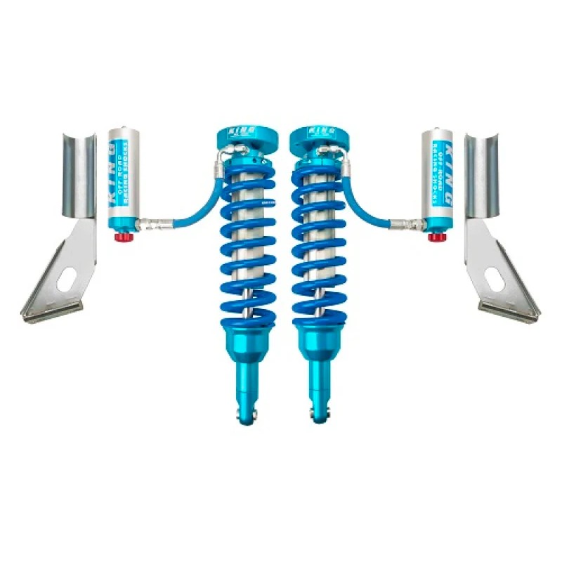Pair of King Shocks 2.5 diameter front coilovers with blue remote reservoirs and compression adjusters.