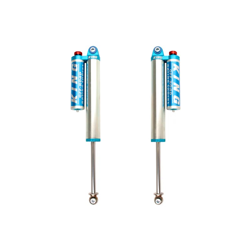 Pair of King Shocks 2.5 inch diameter rear piggyback reservoir shocks with blue compression adjustment knobs.