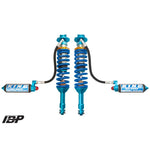 King Shocks 3.0 front coilovers with blue anodized hardware, finned remote reservoirs, and compression adjustment knobs.