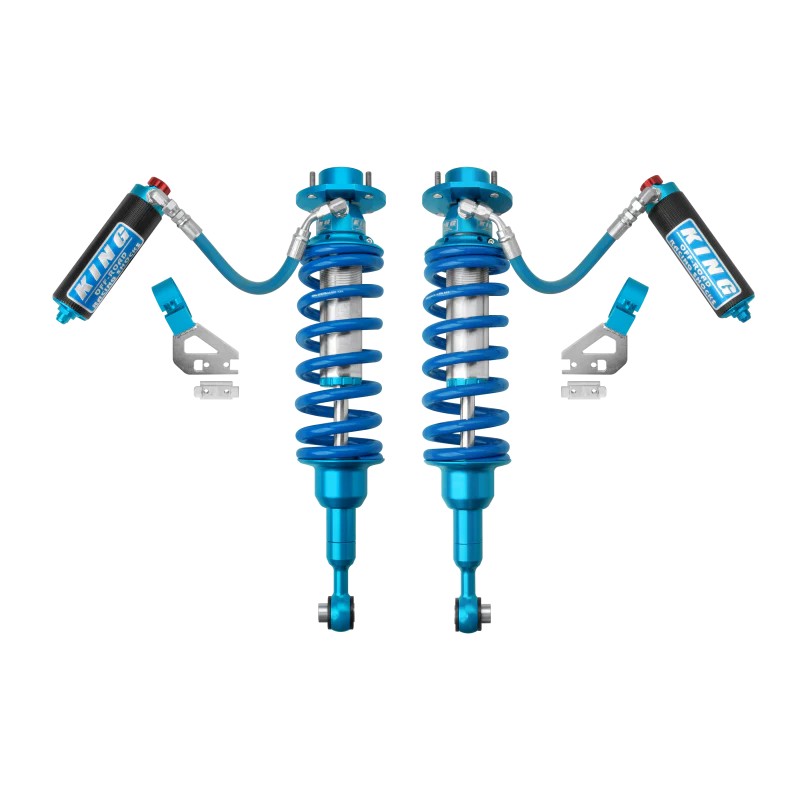 King Shocks 2.5-inch front coilovers with blue remote reservoirs and compression adjusters for 2024-2025 Toyota Tacoma.