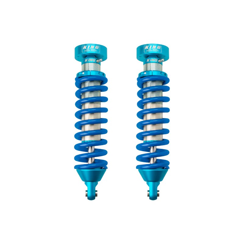 King Shocks 2.5-inch internal reservoir front coilovers with blue coil springs for 1996-2004 Toyota Tacoma.