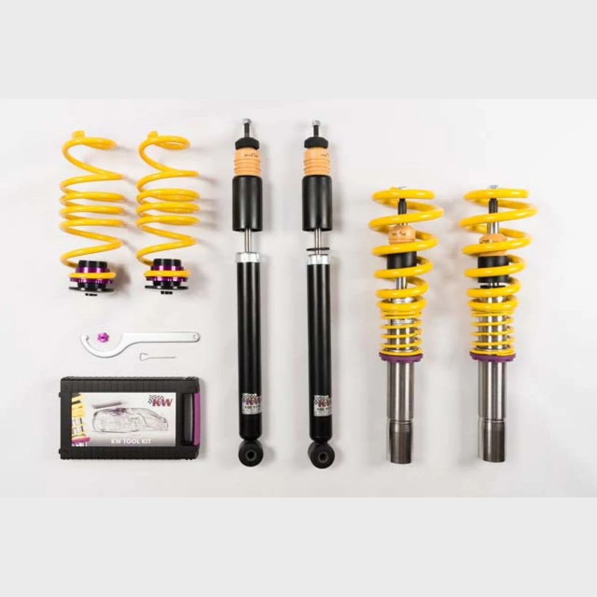 KW V1 Inox-Line stainless steel coilover struts with purple springs and yellow bump stops for Audi B8 chassis.