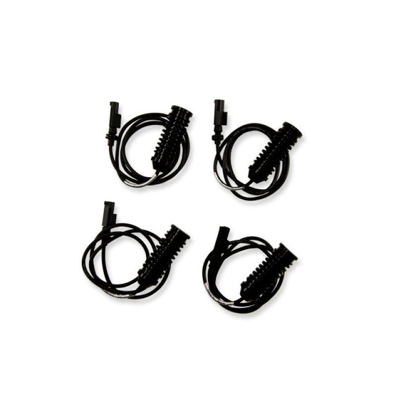 KW Electronic Damping Cancellation Kit modules with OEM-style connectors for BMW Z4 sDrive models.
