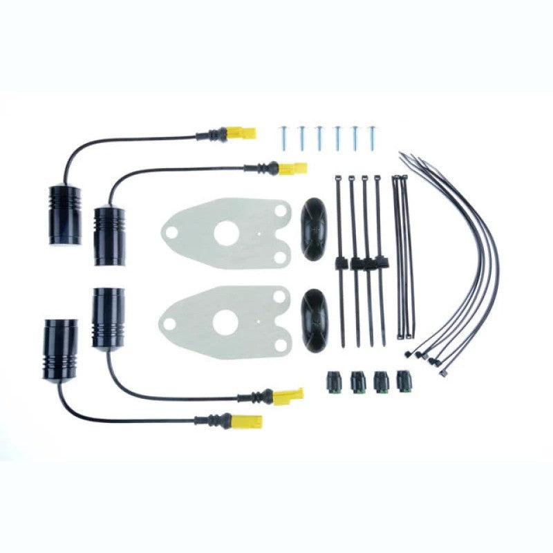 KW Electronic Damping Cancellation Kit modules with plug-and-play connectors for BMW F80 M3 and F82 M4.
