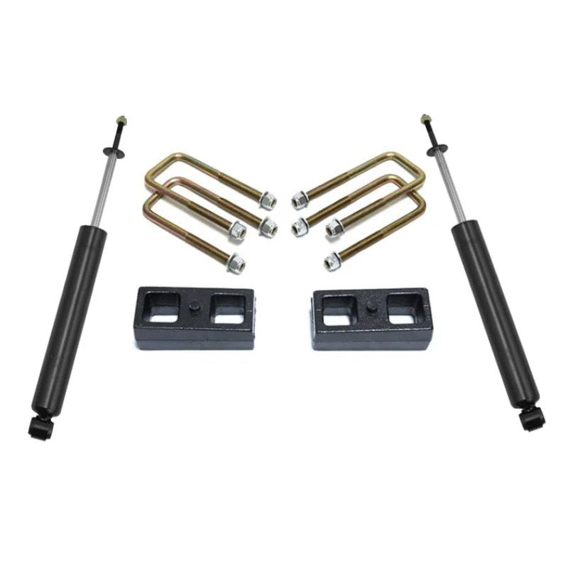 MaxTrac Suspension 2-inch rear lift kit for Toyota Tacoma including blocks, U-bolts, and two rear shocks.