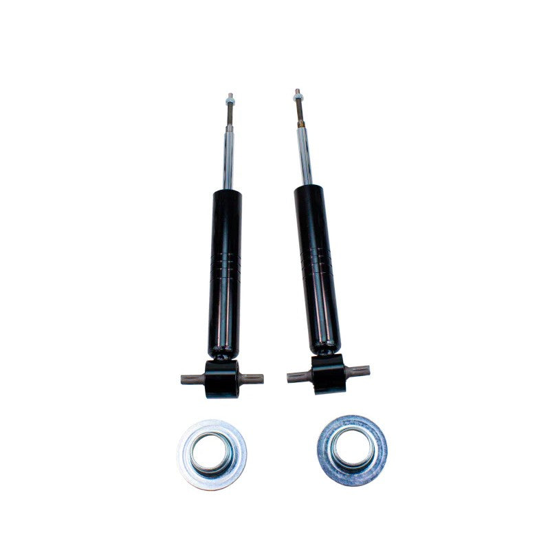 Pair of MaxTrac black adjustable front lowering struts with coil seats and retainer hardware for GM 1500 vehicles.