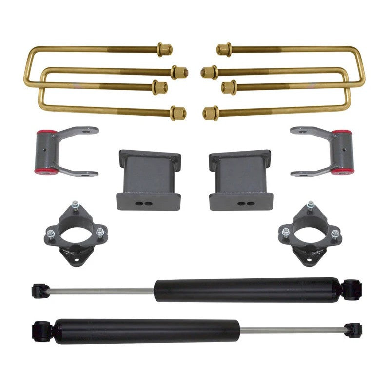MaxTrac 4-inch rear lift kit with lift blocks, U-bolts, strut spacers, and a pair of rear shocks.