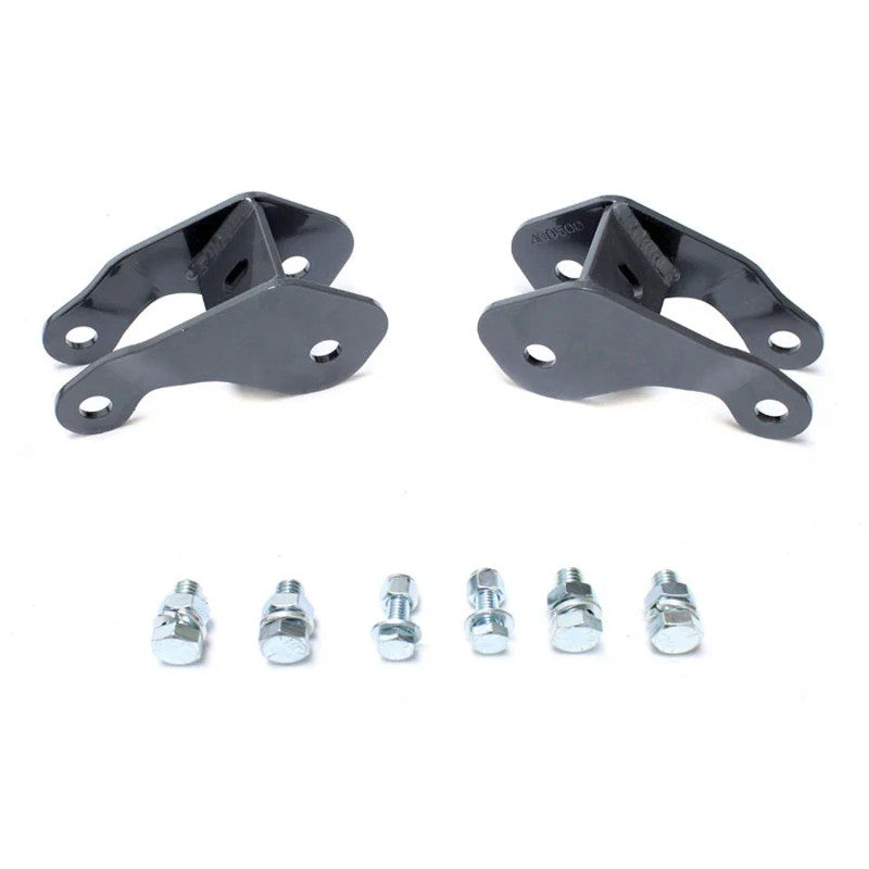 MaxTrac grey powder-coated steel rear shock absorber angle correctors with included mounting hardware.