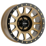 Method MR305 NV 18x9 bronze wheel with black simulated beadlock lip and 12-window spoke design