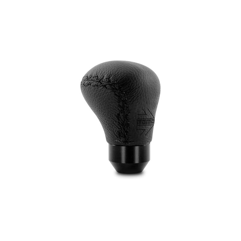 Ergonomic Momo Anatomico manual shift knob wrapped in black leather with matching black stitching.