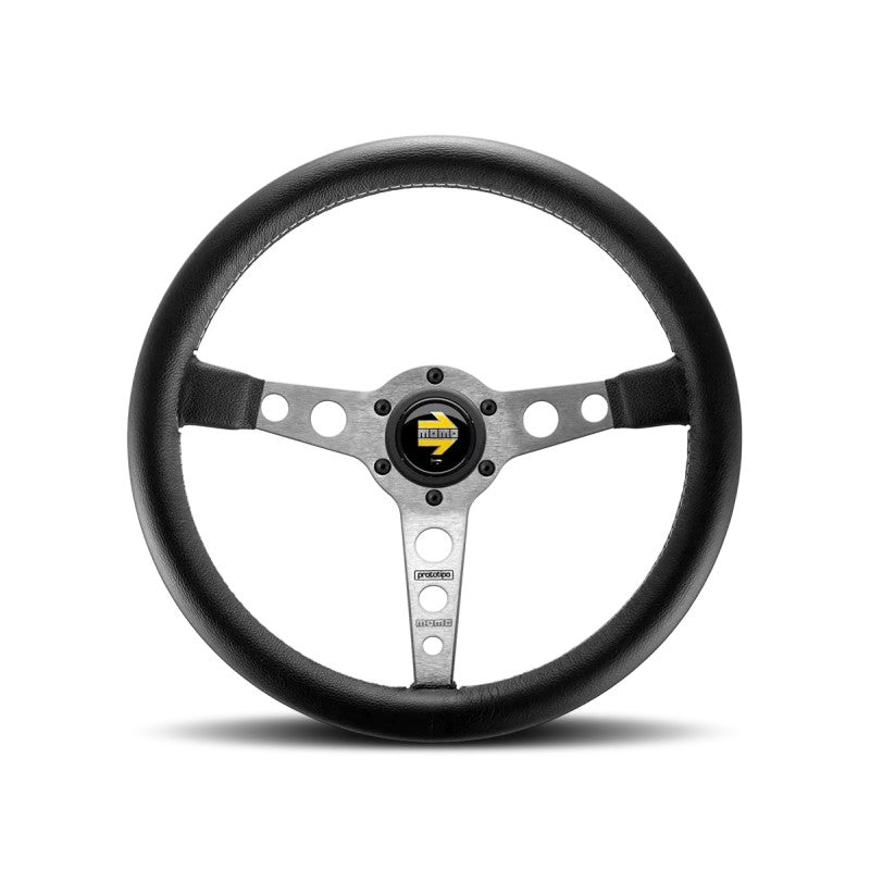 Momo Prototipo 350mm steering wheel with black leather wrap, white stitching, and three brushed aluminum spokes.