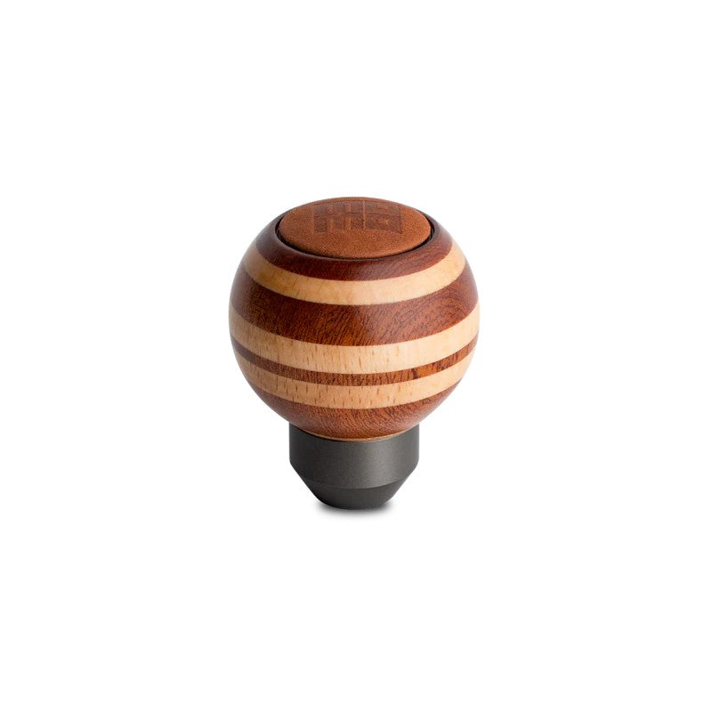 Round Momo Targa Heritage shift knob featuring layered mahogany and beechwood with a black leather top insert.