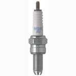 Ten NGK CR9EK Standard Nickel spark plugs with trivalent metal plating and corrugated ceramic insulators.