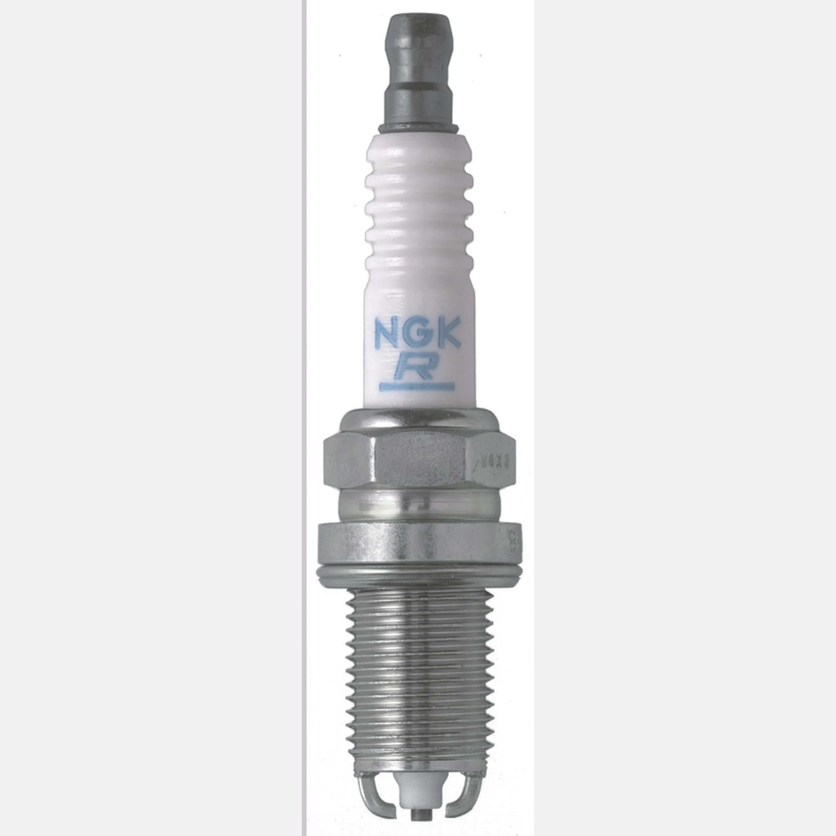 Box of four NGK BKR5EKU nickel alloy spark plugs with white ceramic insulators and silver trivalent metal plating.
