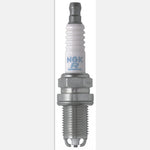 Box of four NGK BKR5EKU nickel alloy spark plugs with white ceramic insulators and silver trivalent metal plating.