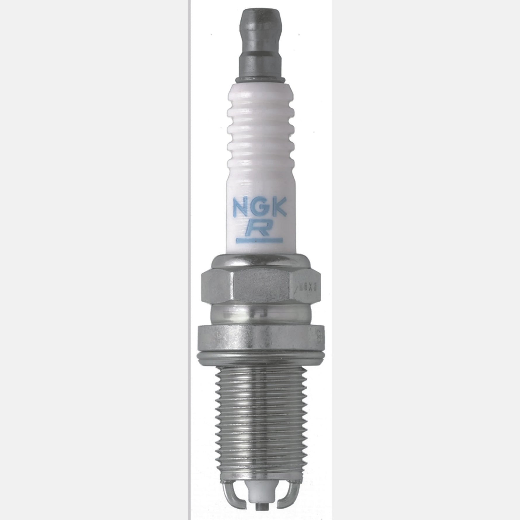 Box of four NGK BKR5EKU nickel alloy spark plugs with white ceramic insulators and silver trivalent metal plating.