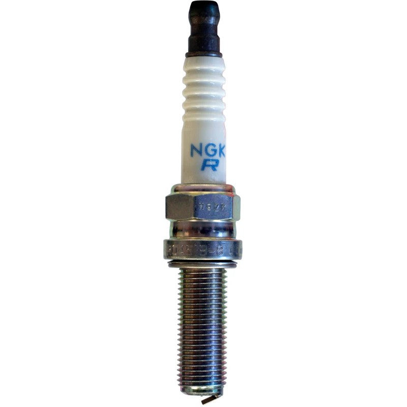 Set of four NGK Racing R0451B-8 spark plugs showing the ceramic insulator and trivalent metal plated shell.