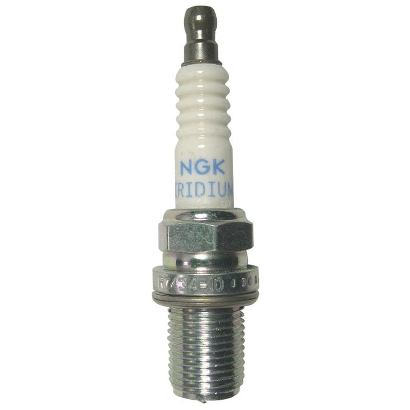 Set of four NGK R7434-10 racing spark plugs featuring white ceramic insulators and trivalent metal plated threads.