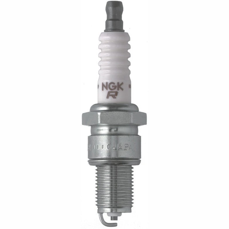Four NGK Standard BPR2ES spark plugs with white ceramic insulators and solid terminals next to yellow retail packaging.