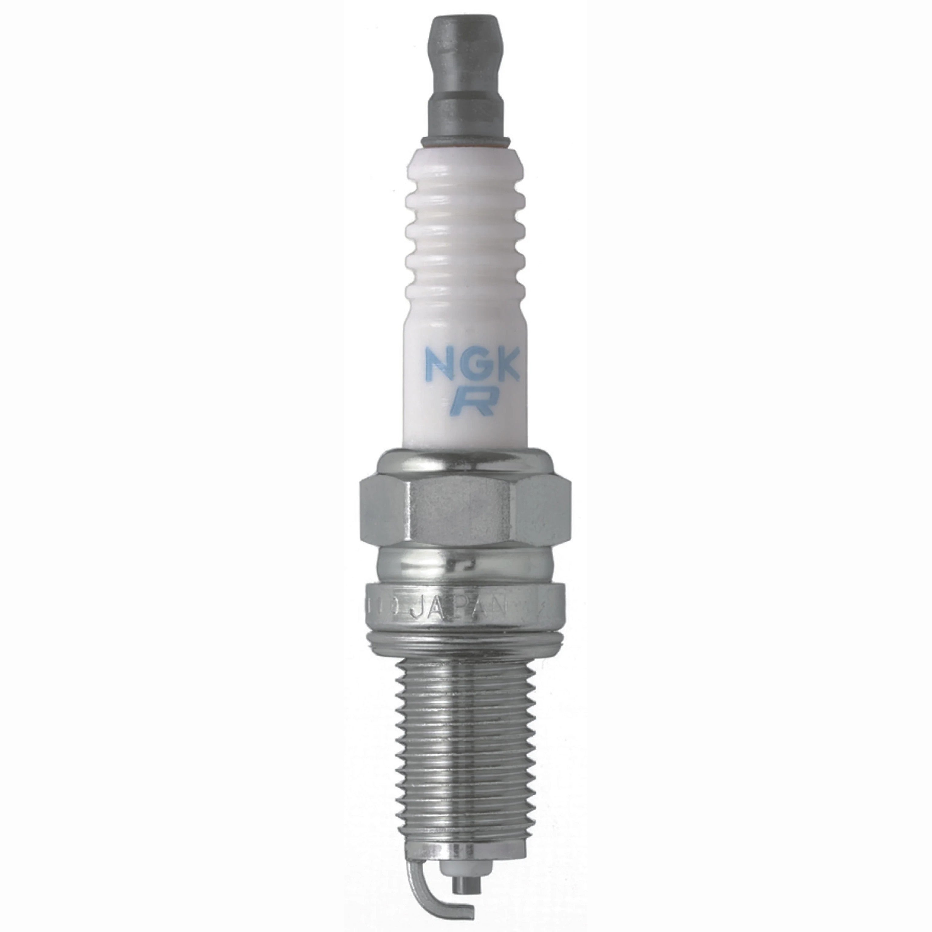 Set of four NGK Standard DCPR6E spark plugs with nickel alloy electrodes and white corrugated ceramic insulators.