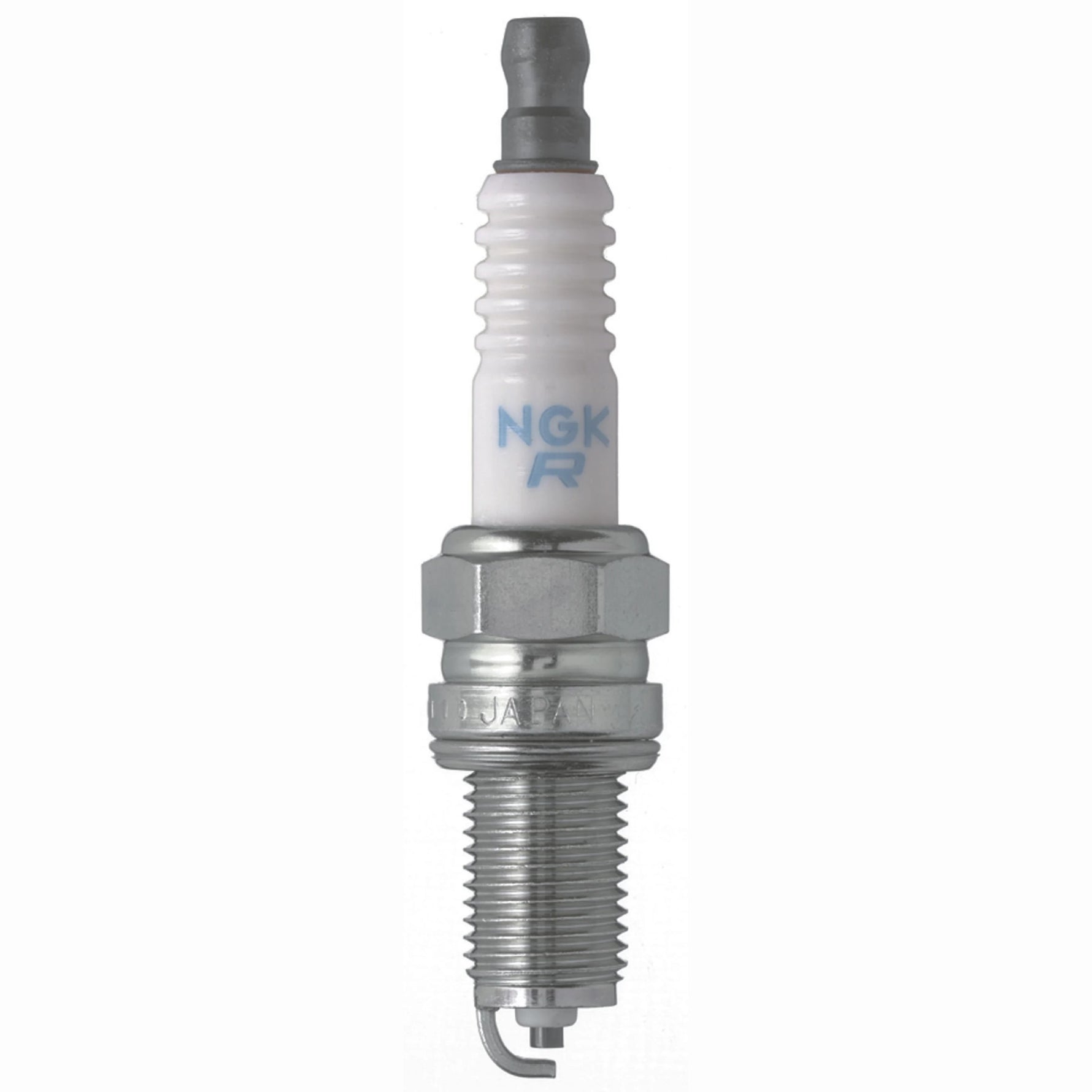 Set of four NGK Standard DCPR6E spark plugs with nickel alloy electrodes and white corrugated ceramic insulators.
