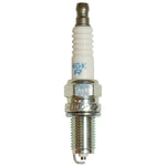 Set of four NGK Standard KR9C-G spark plugs with white ceramic insulators and yellow retail packaging.
