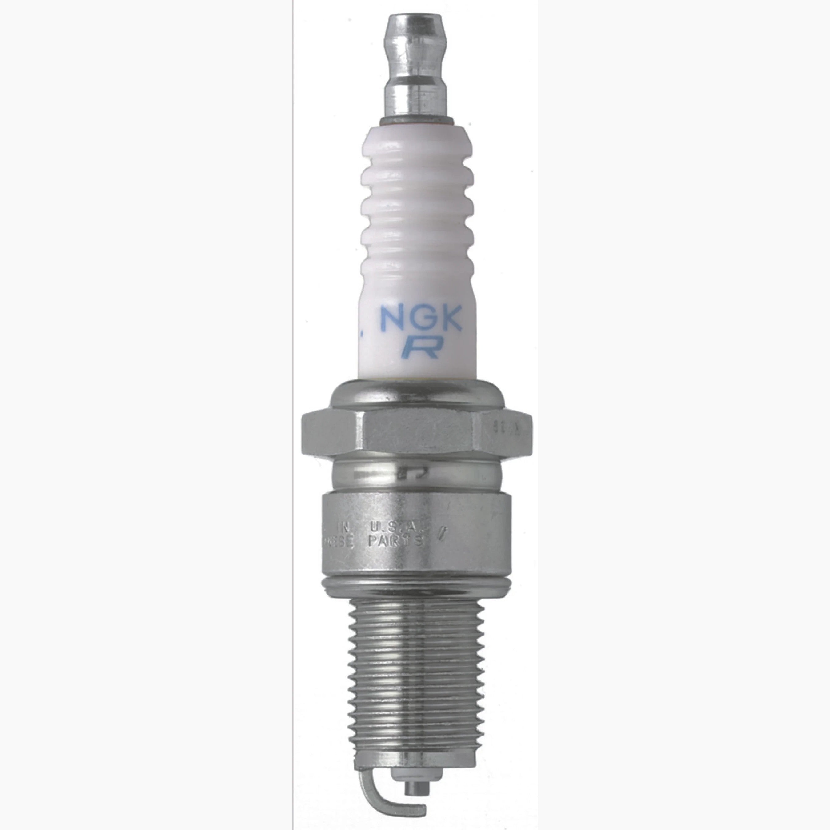 Four NGK BPR7ES Traditional Spark Plugs with yellow box packaging featuring copper core and trivalent plating.