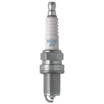 Four NGK Standard BCPR6ES spark plugs with copper cores and nickel alloy tips in yellow boxes.