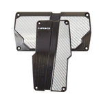 NRG black brushed aluminum automatic transmission pedal covers with silver carbon fiber inserts.