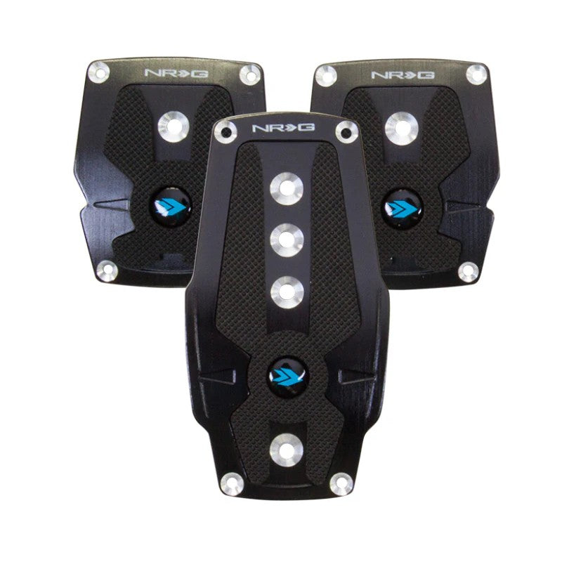 Three black brushed aluminum NRG sport pedals for manual transmission with black rubber grip inserts.