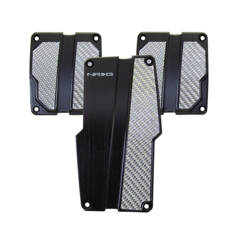 NRG manual transmission sport pedal set in black brushed aluminum with silver carbon fiber inserts.