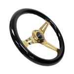 NRG 350mm steering wheel with black wood grain grip and chrome gold 3-spoke center including horn button.