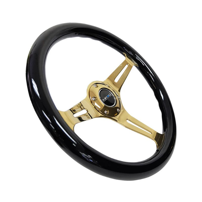 NRG 350mm steering wheel with black wood grain grip and chrome gold 3-spoke center including horn button.