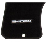 Pair of black NRG floor mats with white embroidered 240SX logo for 1989-1998 Nissan 240SX.