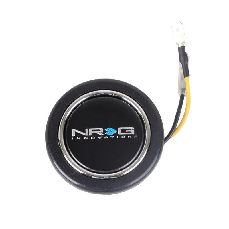 NRG Innovations black circular horn button with a white NRG logo in the center.