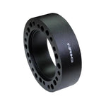 NRG Innovations 1-inch black anodized aluminum steering wheel hub spacer showing dual 6-bolt mounting patterns.