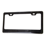 Genuine NRG carbon fiber license plate frame featuring a glossy weave finish and standard four-hole mounting design.