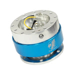 NRG SRK-100BL low-profile steering wheel quick release adapter with black body and blue chrome accent ring.