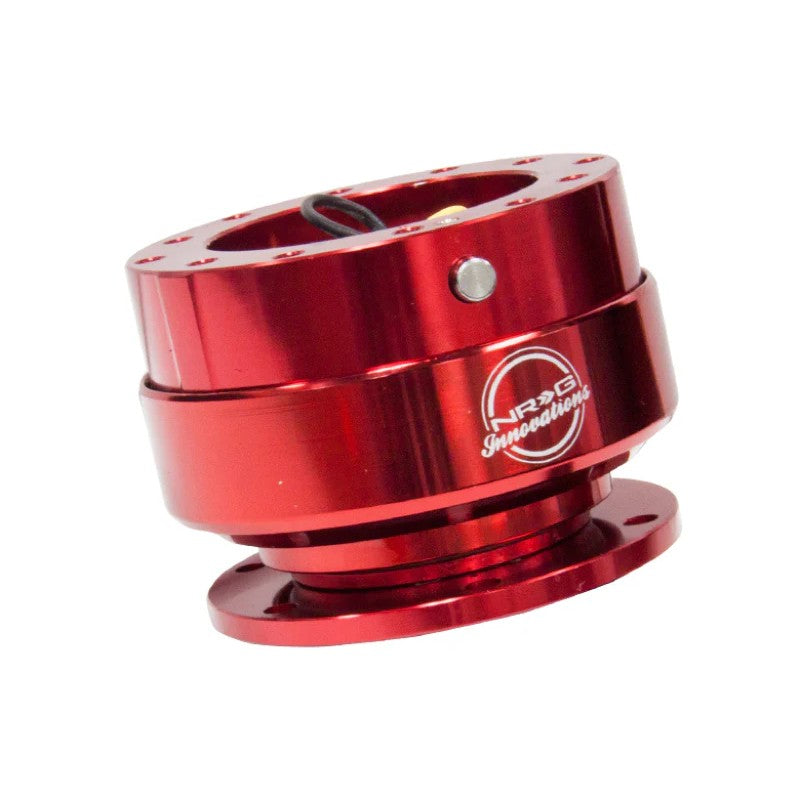 Red anodized aluminum NRG Gen 2.0 steering wheel quick release hub with raised finger grooves.