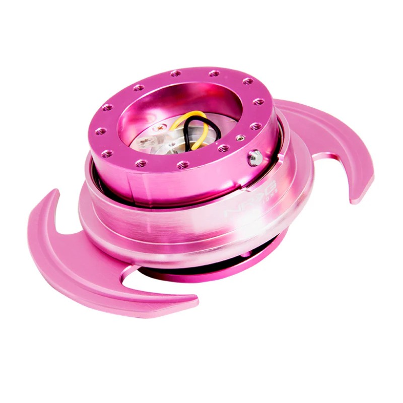 Pink NRG Gen 3.0 steering wheel quick release with wing-style handles and 6-bolt mounting pattern.